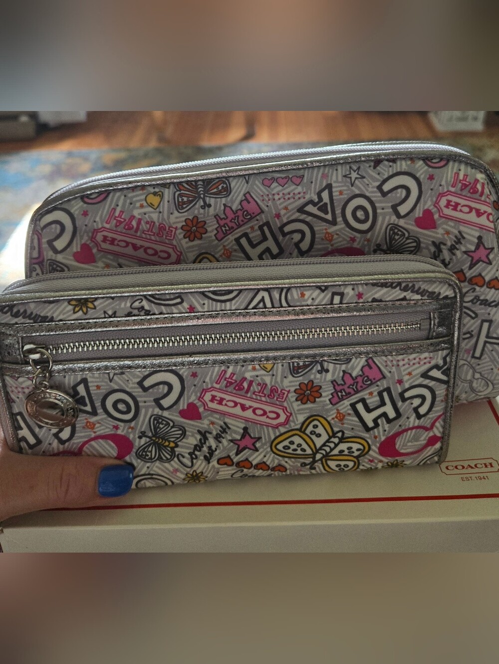 Coach Zip-Around Wristlet And Makeup Bag in Metallic Silver with Pink Lining